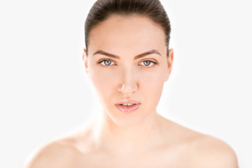 Close up portrait of beautiful woman with blue eyes.