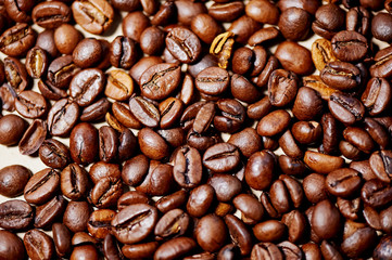 Roasted brown coffee beans, can be used as a background and texture
