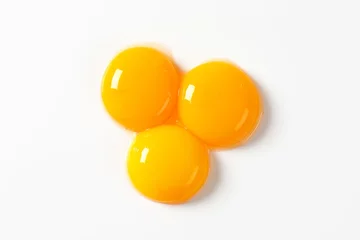 Fotobehang Raw egg yolks © Viktor