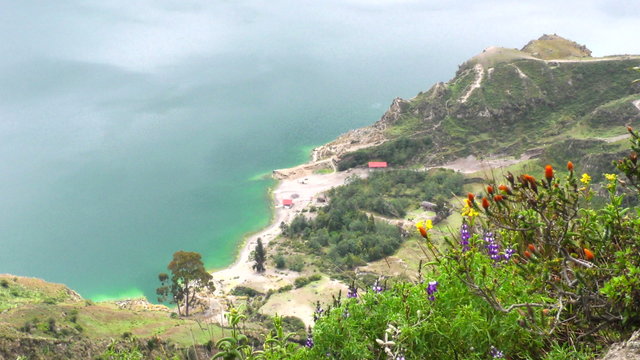 Experience breathtaking views of the Quilotoa Crater Lagoon,an extinct volcano nestled in the stunning Ecuadorian Andes Mountains.