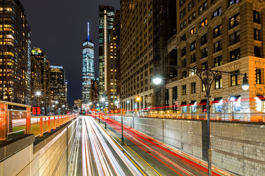 Fototapeta Traffic trails in downtown New York City at the entrance in Battery Park tunnel