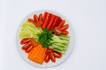 Obraz na płótnie Canvas Greek Salad, carrots, basil, cucumber, pepper, olives.