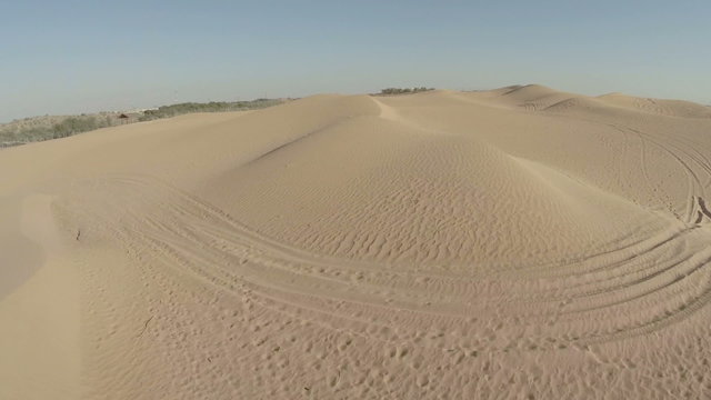 Yellow desert dunes and sky aerial.