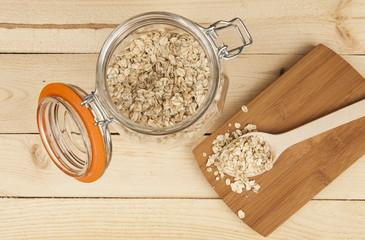 Oatmeal Oats on the wooden table in the jar