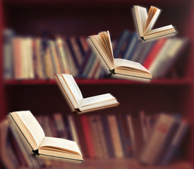 Flying open books in library