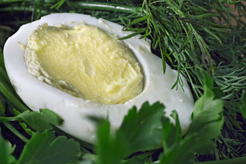Sliced boiled egg with fresh herbs