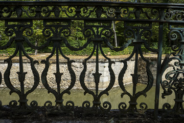 iron gate in an old nineteenth century style garden in Spain
