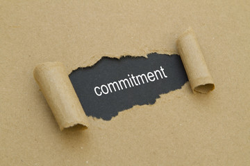 Commitment word written under torn paper.