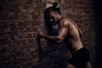 Fototapeta premium Young man and wall
