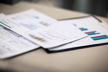 financial charts and graphs on the table