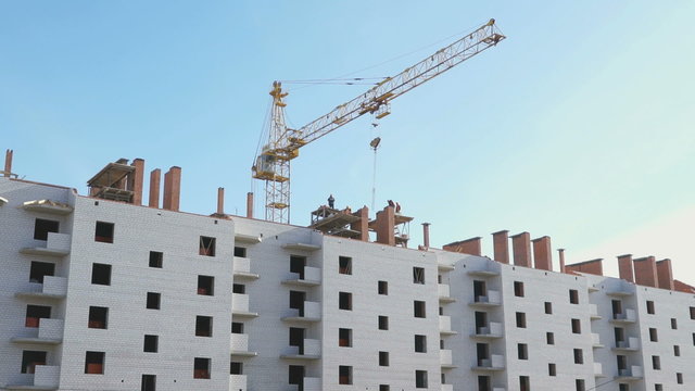 Construction crane working on a apartment building