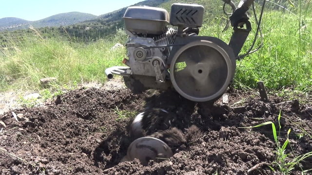 Close up shot of a tillage cultivator in operation. Clip with audio.