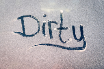 Dirty Text on a Grubby Dust Covered Window