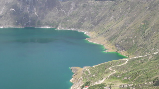 Experience breathtaking views of the access route as you tilt over the west side of Quilotoa Crater.