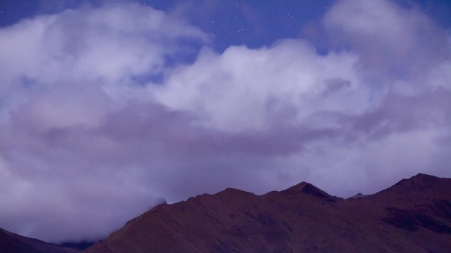 Experience the breathtaking time lapse over Ecuador's El Altar volcano at night,as the clouds part to reveal one of South America's most stunning and challenging climbing destinations.
