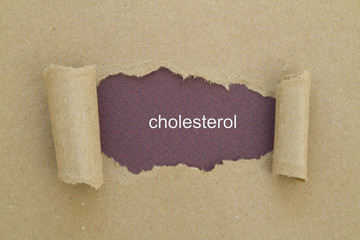 Cholesterol word written under torn paper.