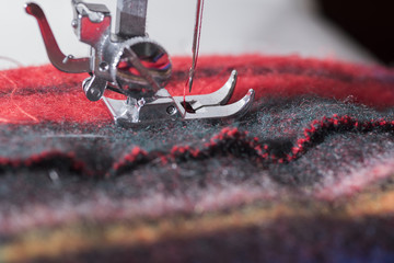 view of a tailored suit from a tailor in his studio. Dress sewn with sewing machine