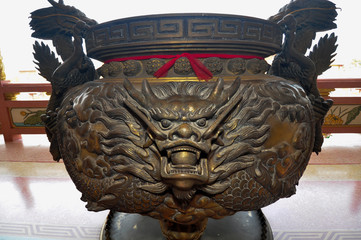 Dragon decorated at the incense burner  of Chinese shrine in Thailand
