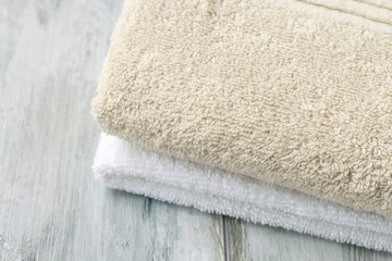 Two towels on wooden table