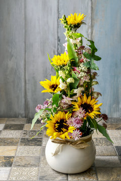 Floral arrangement with sunflowers and matthiolas