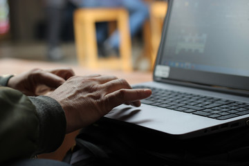 Business men typing on laptop