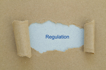 Regulation written under torn paper.