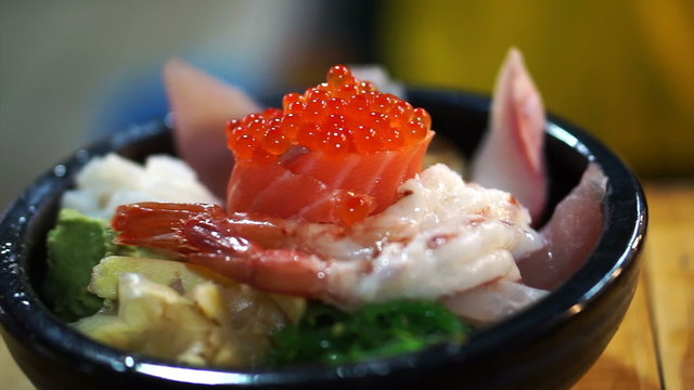 Japanese gourmet sashimi over rice bowl. Chirashi Assorted seafood