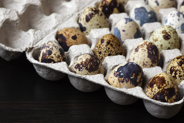 quail eggs in a paper box. Dietary food for each day