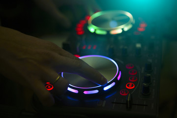 DJ console music party in nightclub