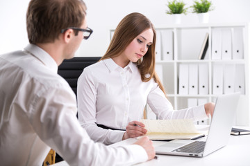 Businessman and businesswoman at work