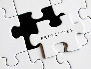 Priorities written on missing puzzle.