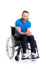 Fototapeta na wymiar disabled man in wheelchair train with bar-bell