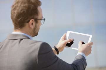 Business professional using digital tablet device out of the office   