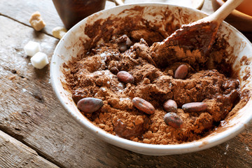 Preparing dough for chocolate pie on table close up