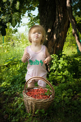 girl and basket of strawberries
