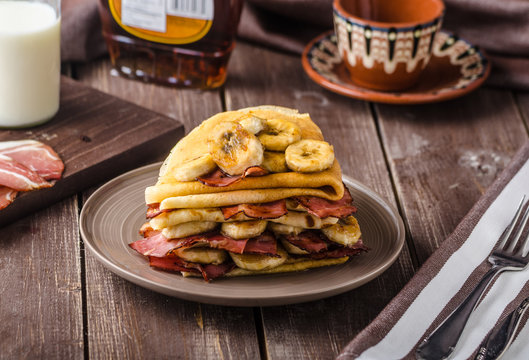Pancakes with bacon, banana and maple sirup