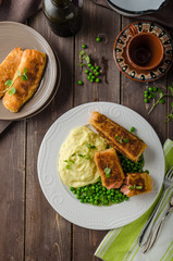 Fried salmon with mashed potato and vegetable