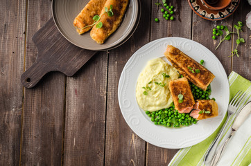 Fried salmon with mashed potato and vegetable
