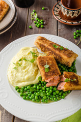 Fried salmon with mashed potato and vegetable