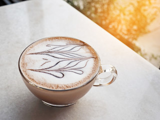 Cup of coffee on table in cafe