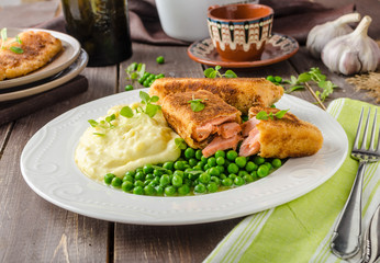 Fried salmon with mashed potato and vegetable