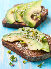 toast with slices of avocado and spices