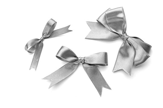 Beautiful silver bows isolated on white background