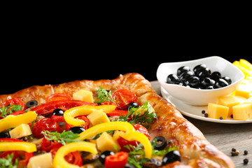Freshly homemade pizza on black background