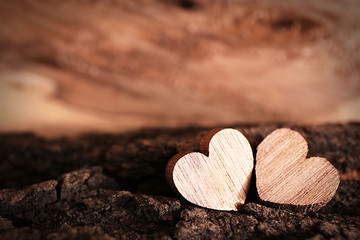 Obraz premium Valentine concept. Two love hearts on wooden background