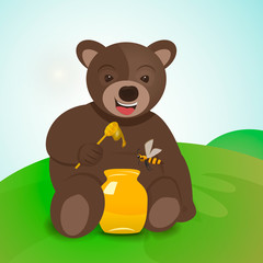 Obraz premium Teddy bear sitting on the grass and eating honey.