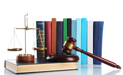 Wooden gavel with justice scales and stack of books, isolated on white