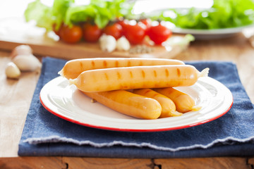 grilled sausage in plate with vegetable