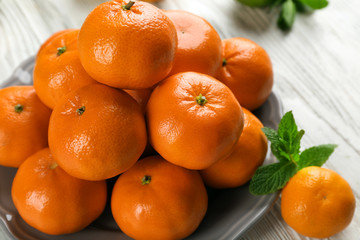 Pile of mandarin on light wooden background