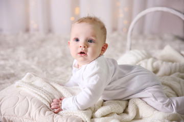 Portrait of adorable baby on the floor, close up